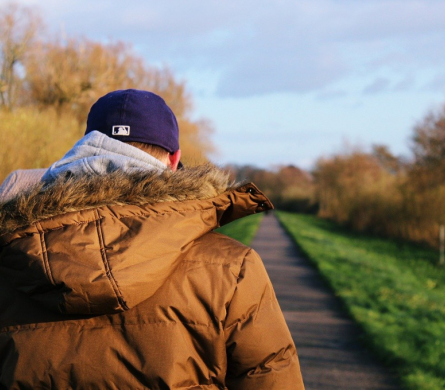 Young person walking along path