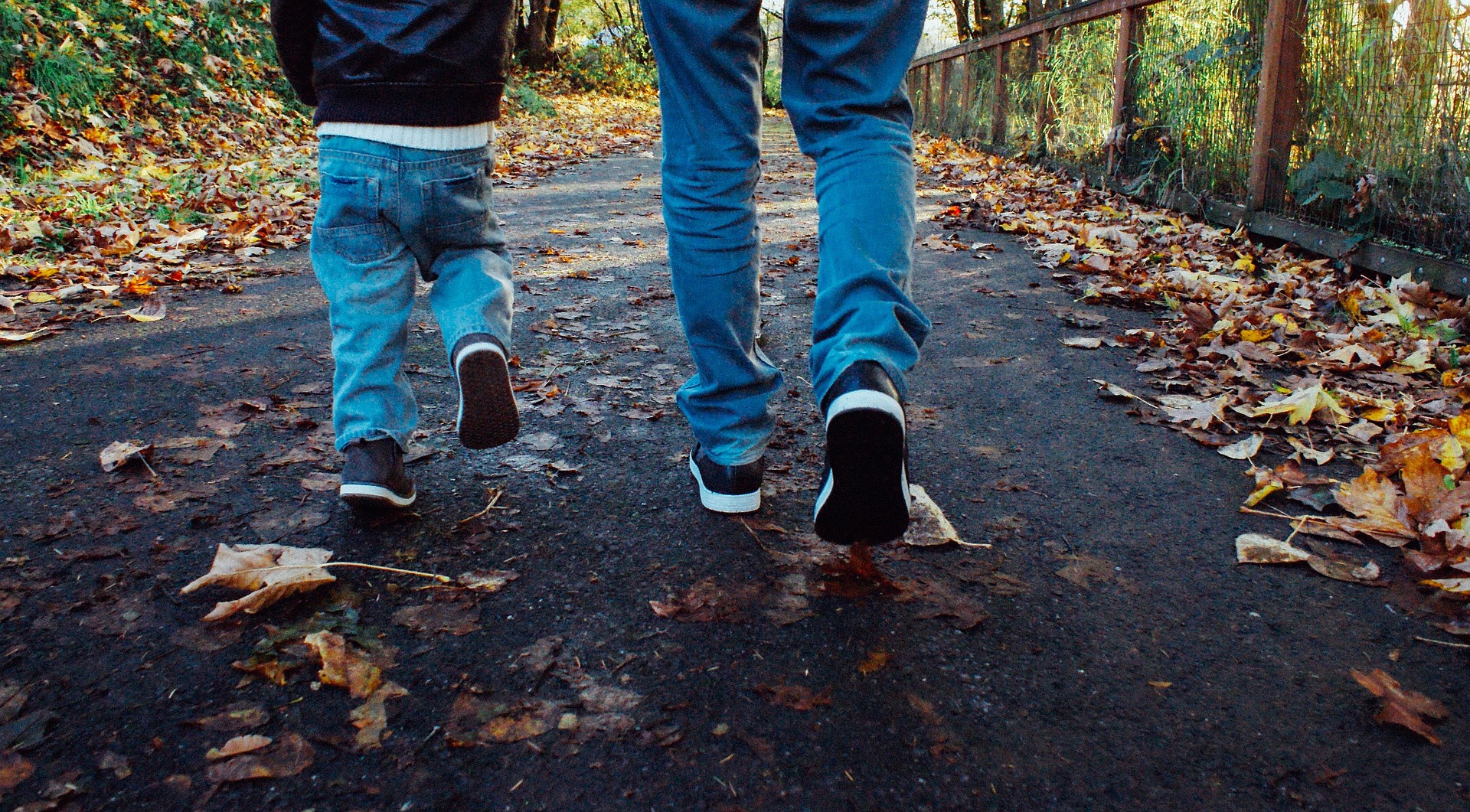 child and parent walking