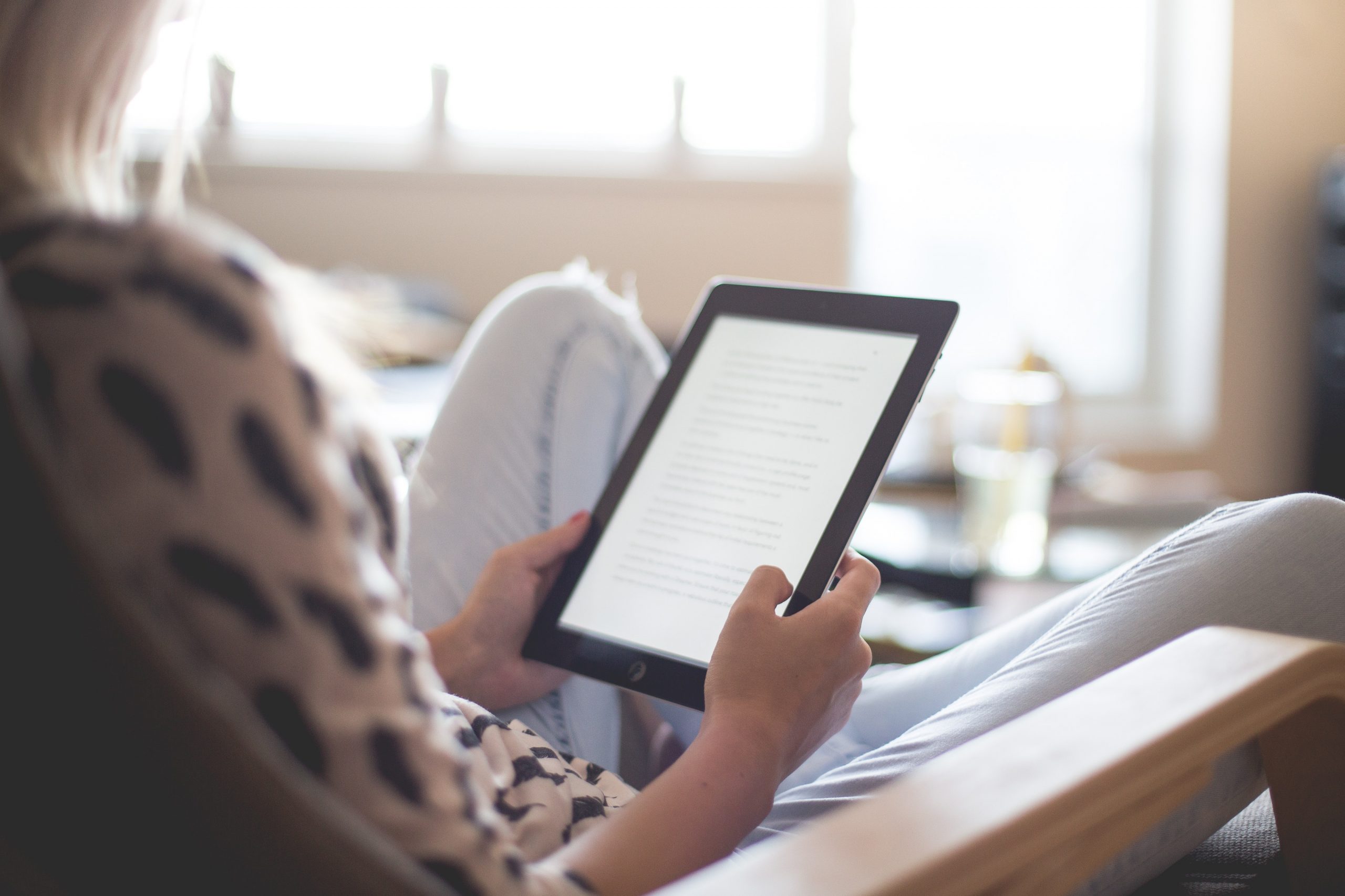 Woman reading tablet