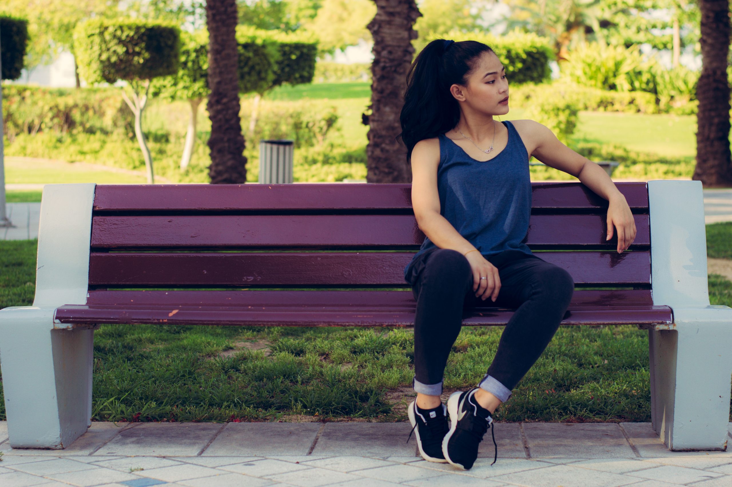 Young person sitting at bench