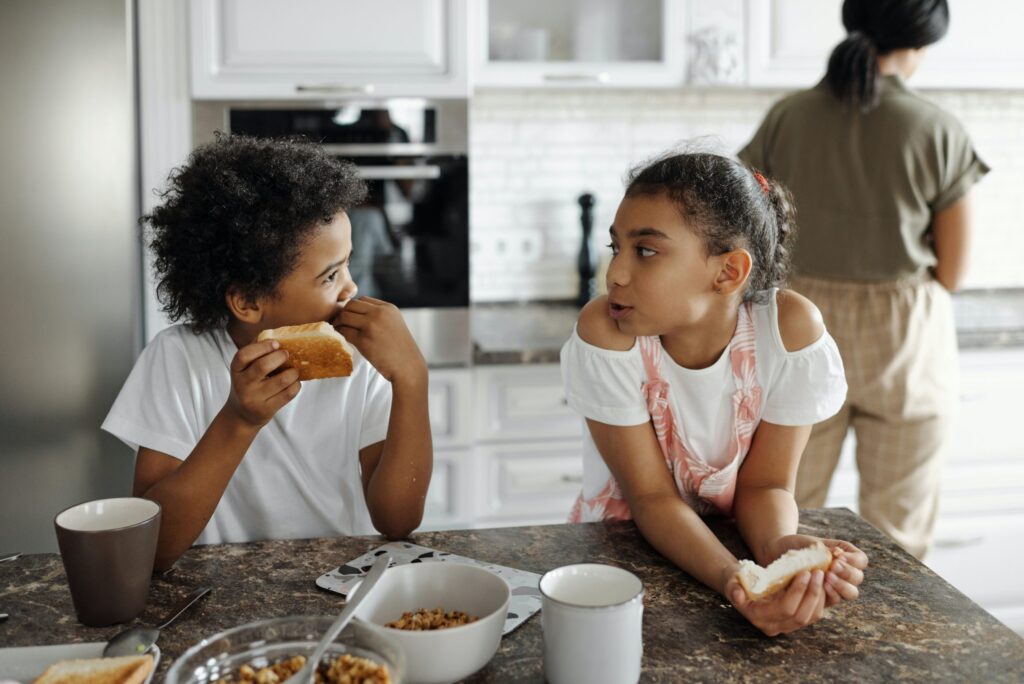 Brother and sister eating