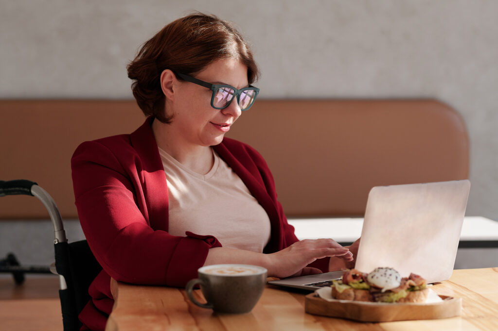 Woman writing on laptop