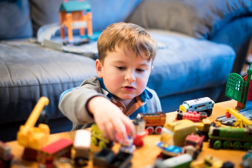 Young boy playing with toys