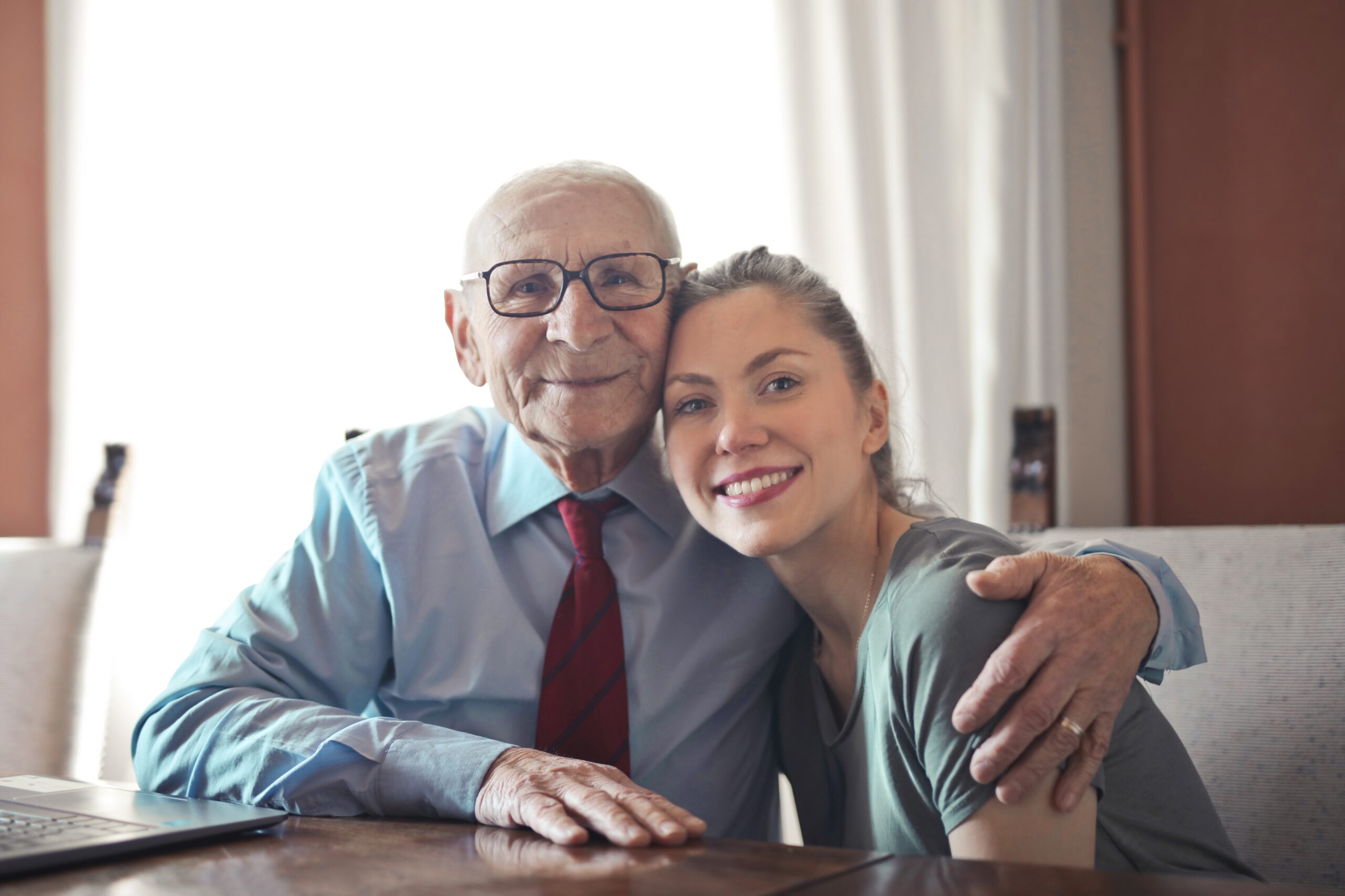 Elderly man and young woman