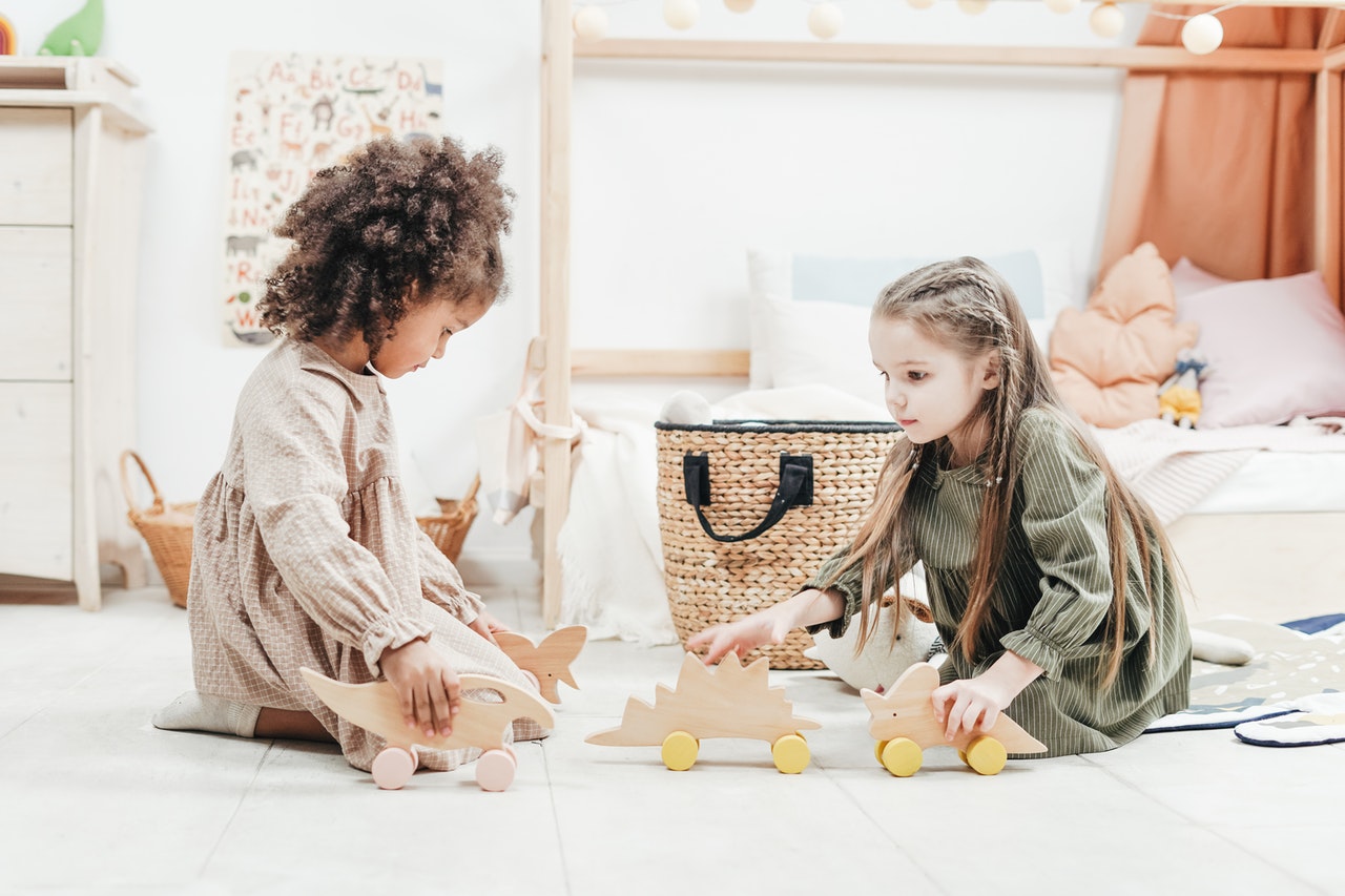 Two young children playing with toys