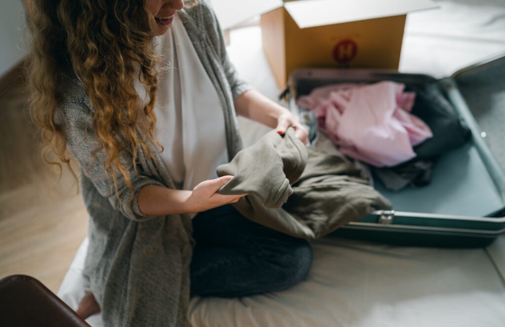 Woman packing clothing