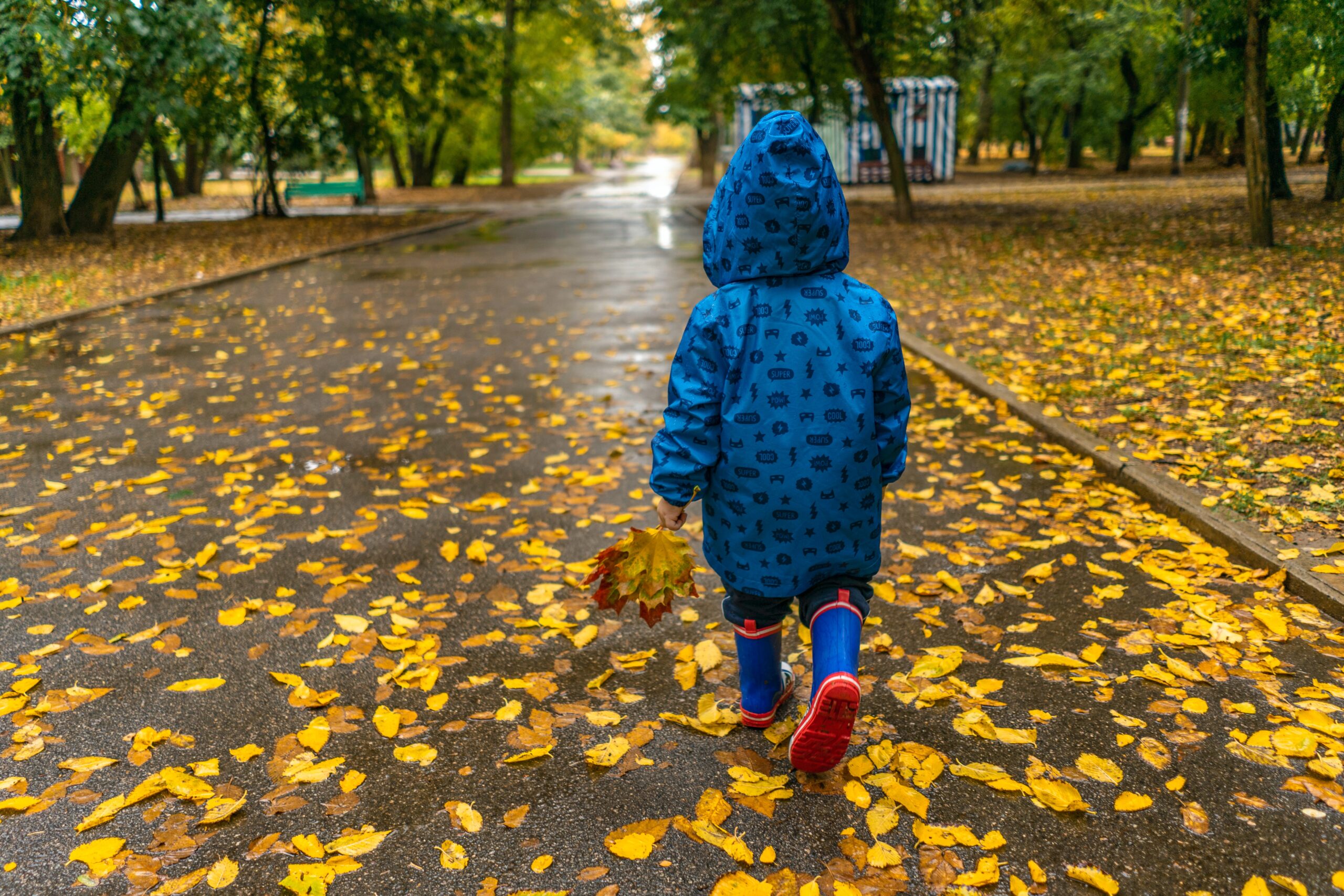 Child walking in rain