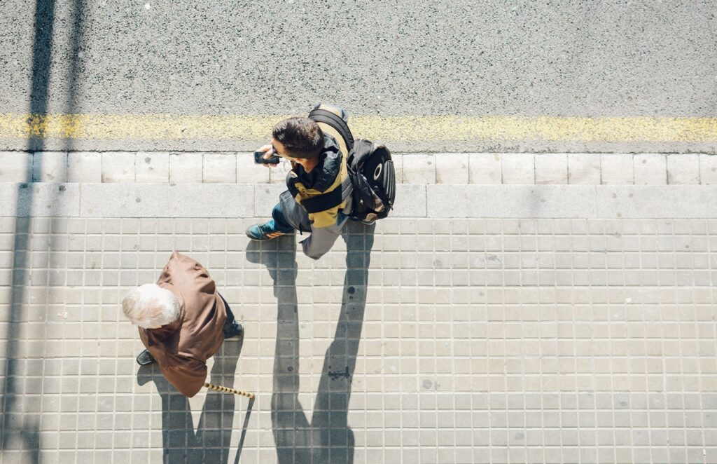 young person and adult walking