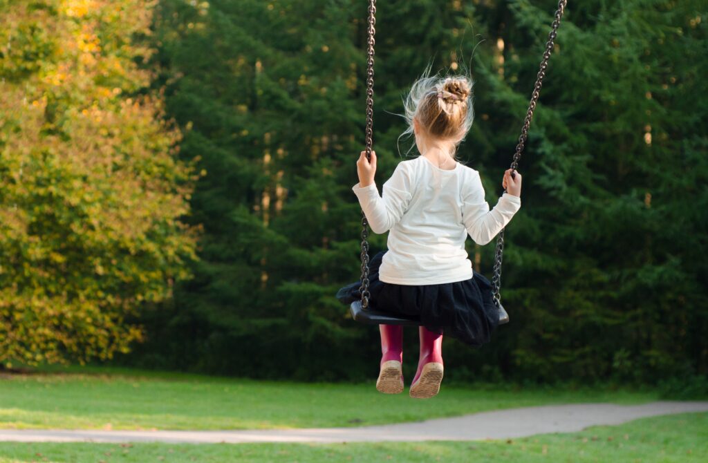 Young girl on a swing