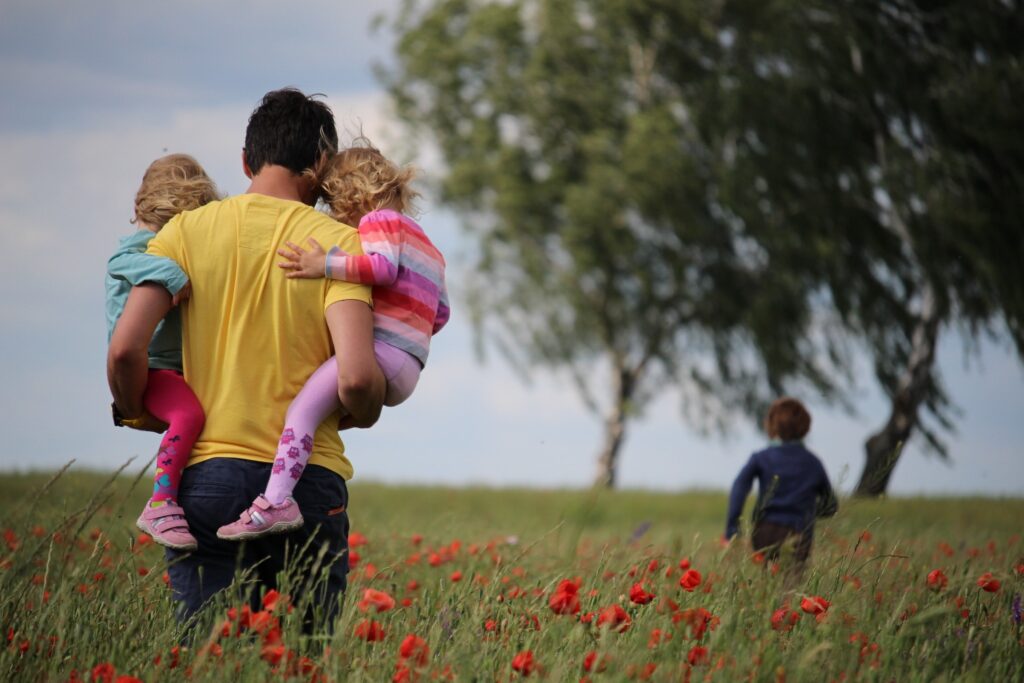 Father and children outside