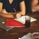 Women at desk writing