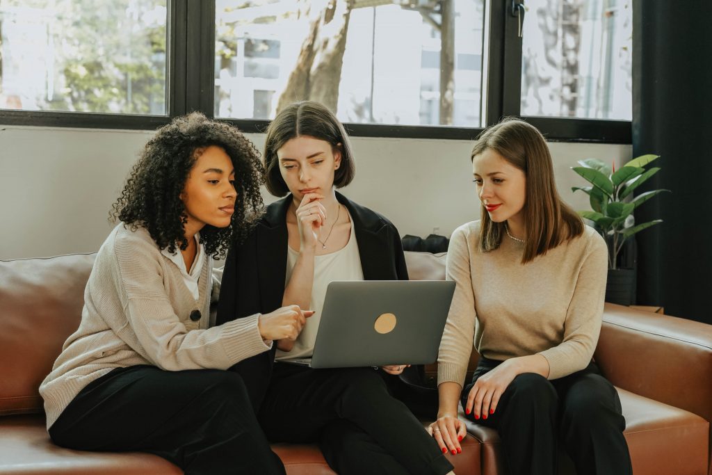 Three young woman working together