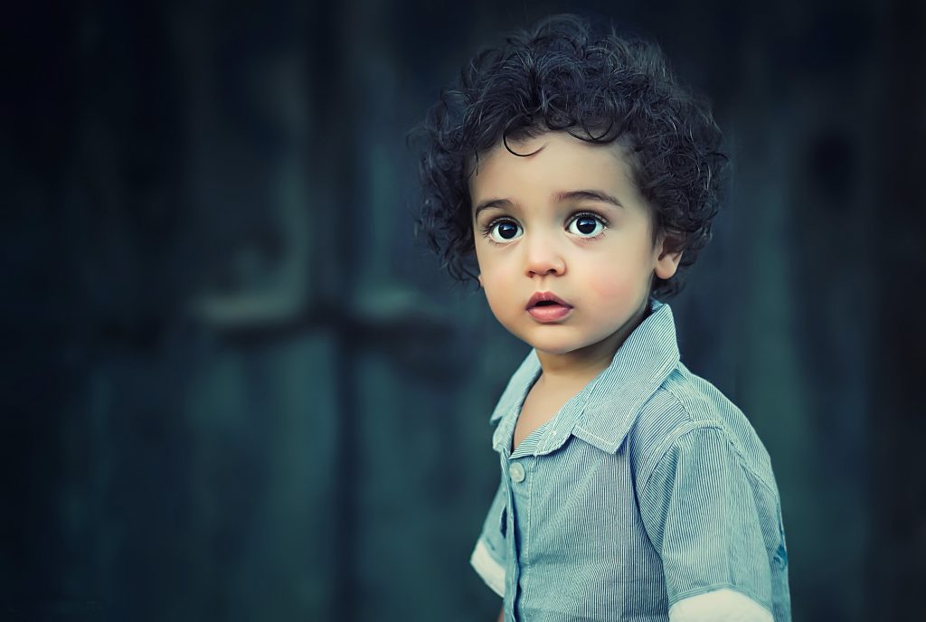 Child with blue shirt