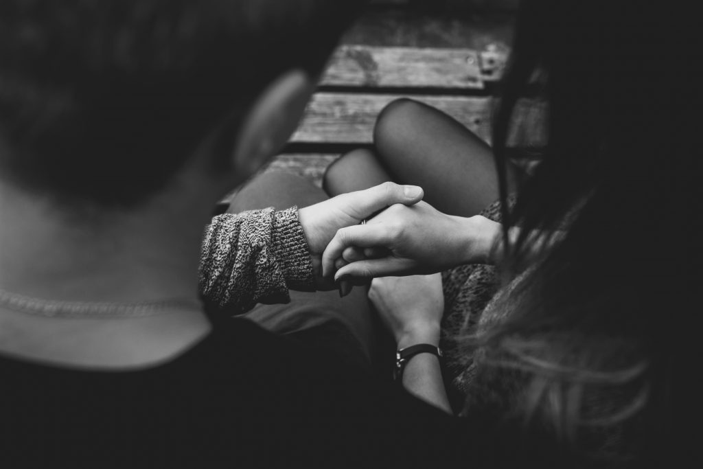 Two adults holding their hand