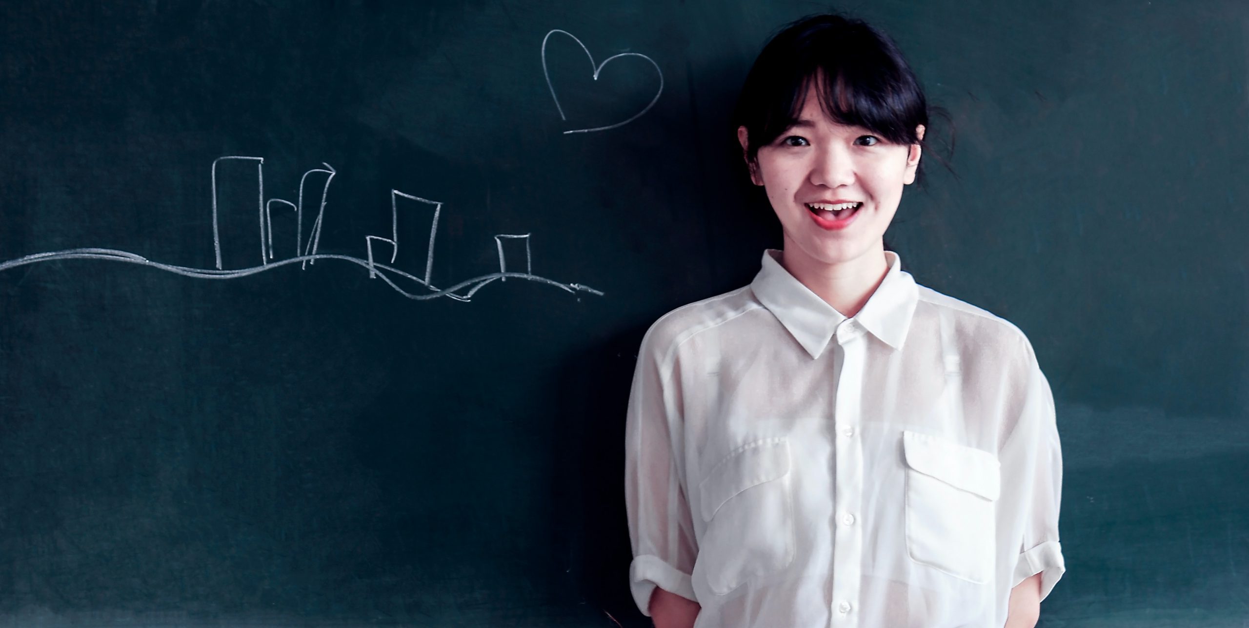 Student resting on the blackboard