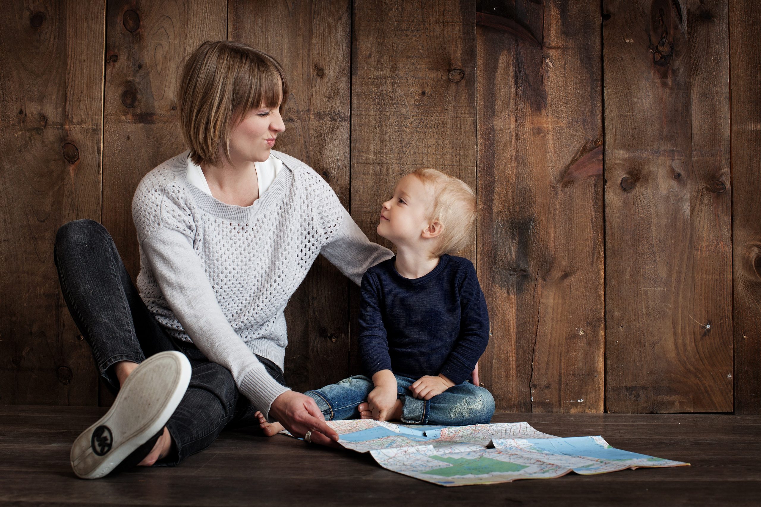 Woman and child reading a map