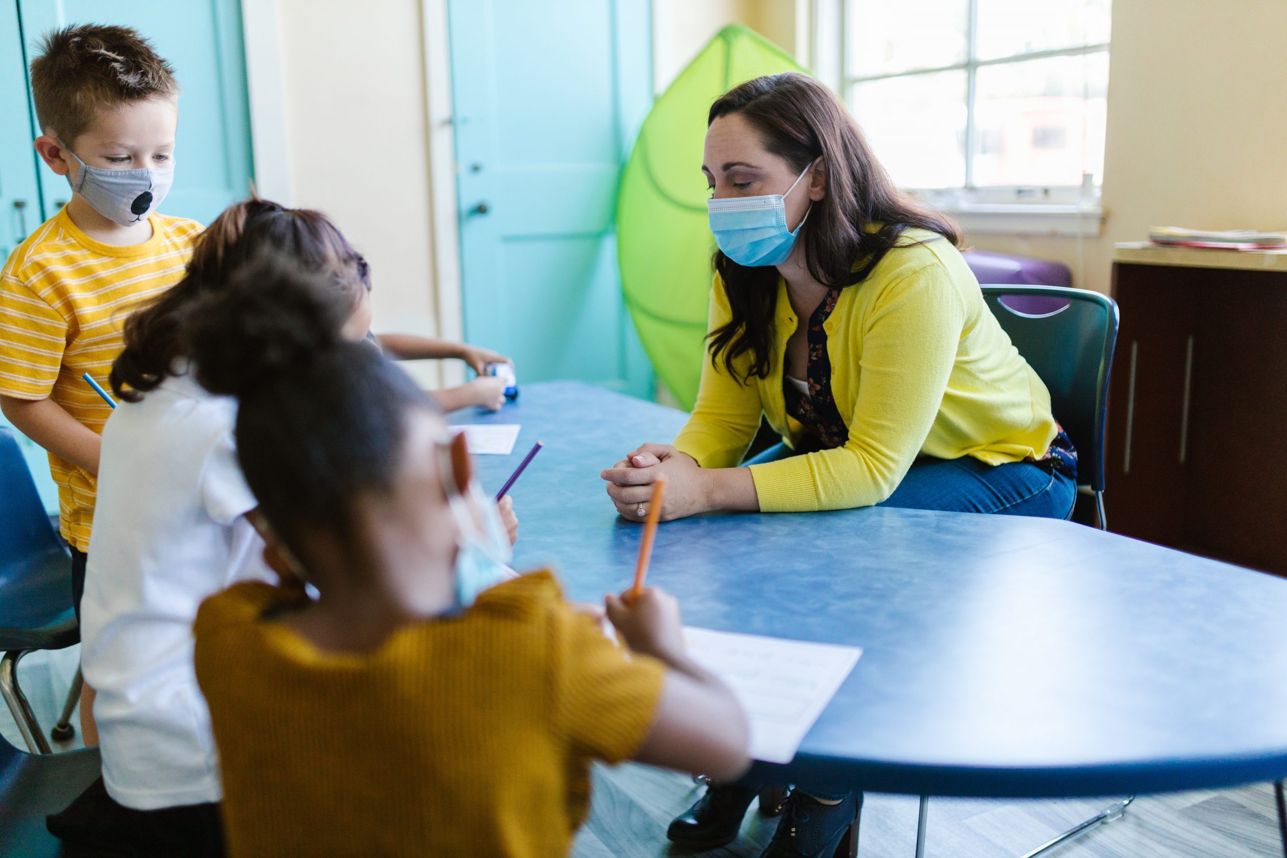 Woman with children wearing face masks