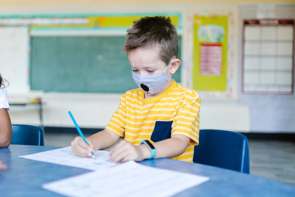 Child with a face mask