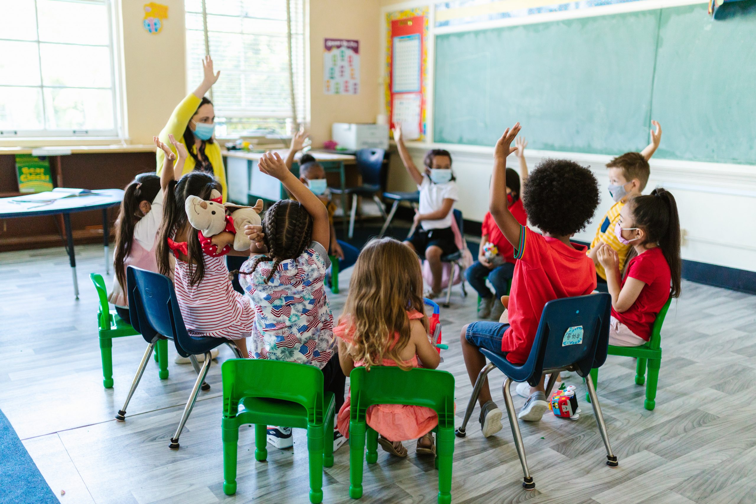 Teacher and pupils in classroom participation