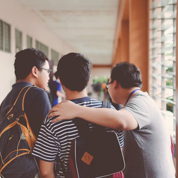 Teacher and students in a corridor