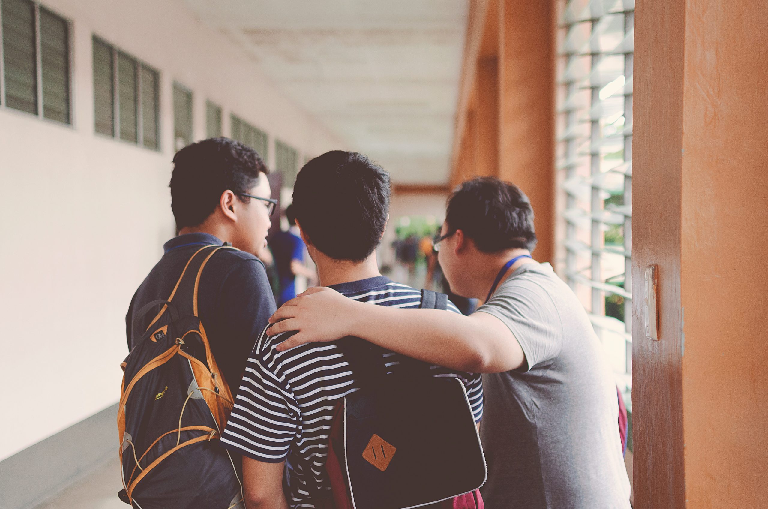 Teacher and students in a corridor