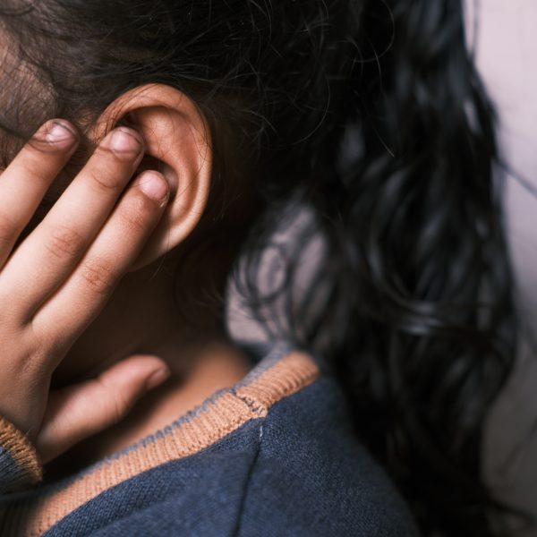 Child covering their ears