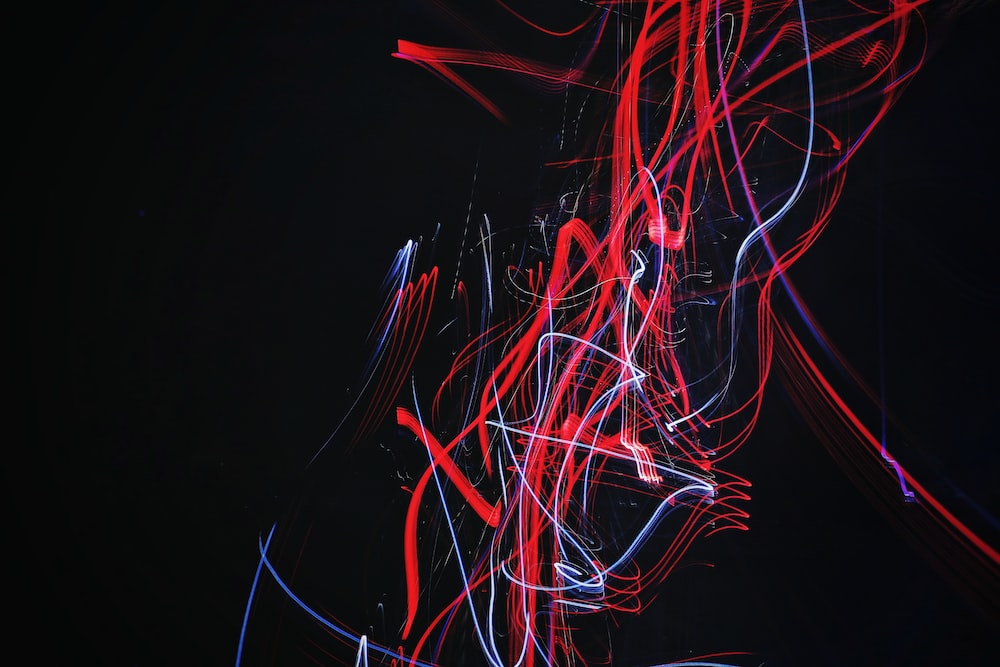red and blue doodle artwork with black background