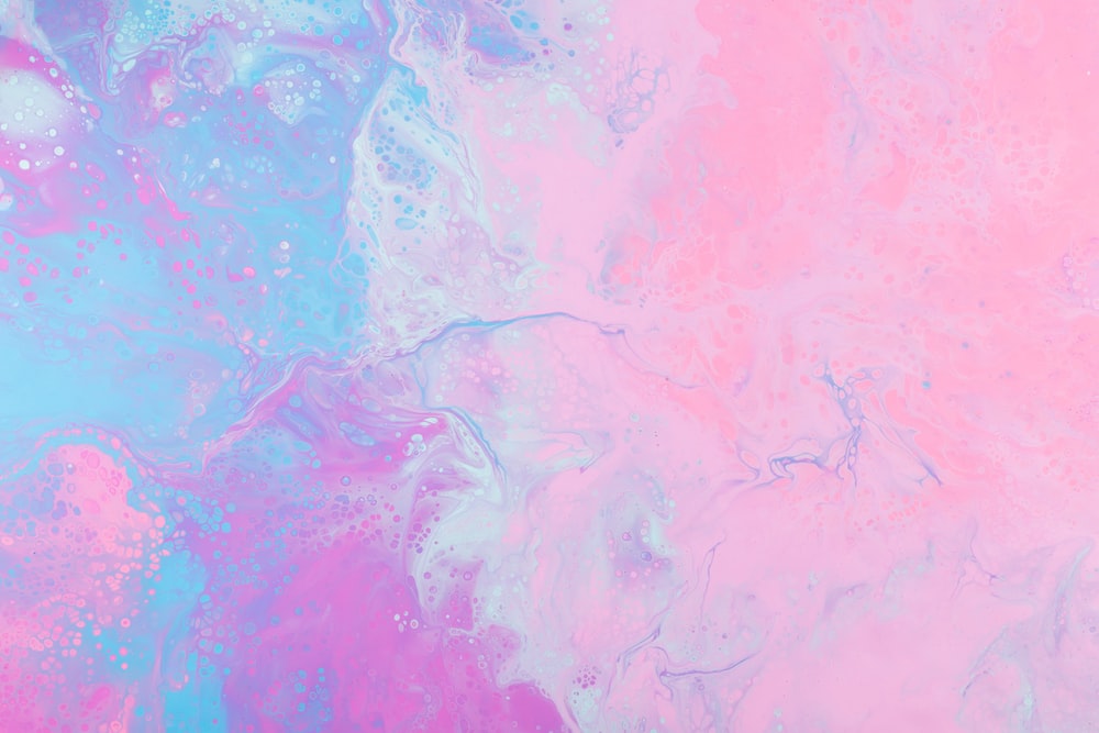 a pink and blue background with a lot of bubbles